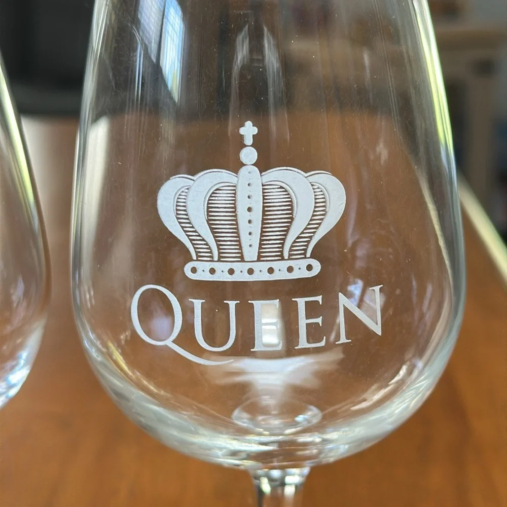 DuVino wine glasses. “King” & “Queen” along with crowns. Clear, white writing